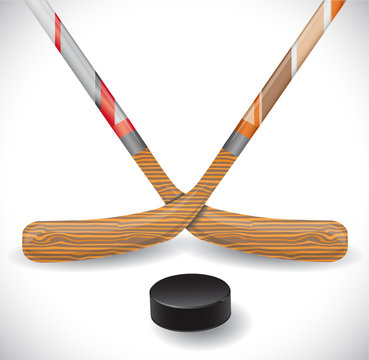Hockey sticks and hockey puck.  Illustration 10 version