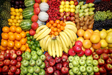 Freshly harvested collection of organic fruits as background