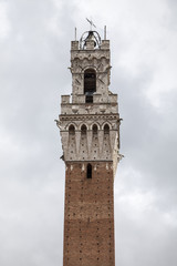 Fototapeta premium Sienna, Torre del Mangia (Palazzo Pubblico) at the Piazza del Campo, Tuscany, Italy, Europe