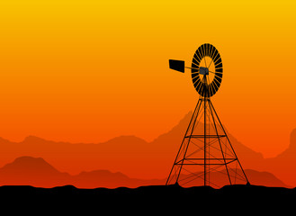 silhouette of a water pumping old windmill, windmill water tower at the desert