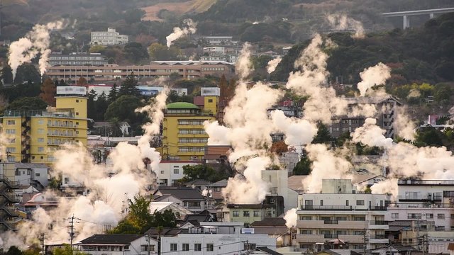 Beppu, Japan cityscape with hot spring bath houses.