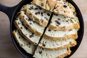 Sliced Irish soda bread in a cast iron pan