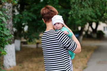 Mother with newborn daughter in park