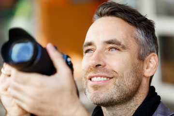 Male photographer taking picture