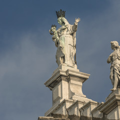 Fototapeta na wymiar Statue of Saint Maria at Basilica Santa Maria Salute Venice