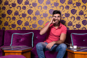 Man Drinking Coffee In The Cafe Bar