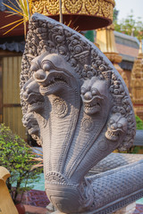 Stone carved of five-headed snake as decoration.