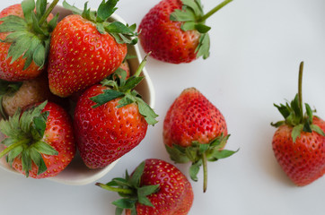Fresh Strawberries In Bowl On White Fabric Background.