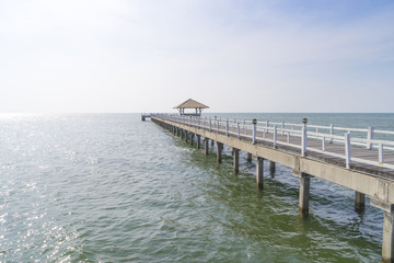 Fototapeta premium The wooden bridge walkway into the sea.