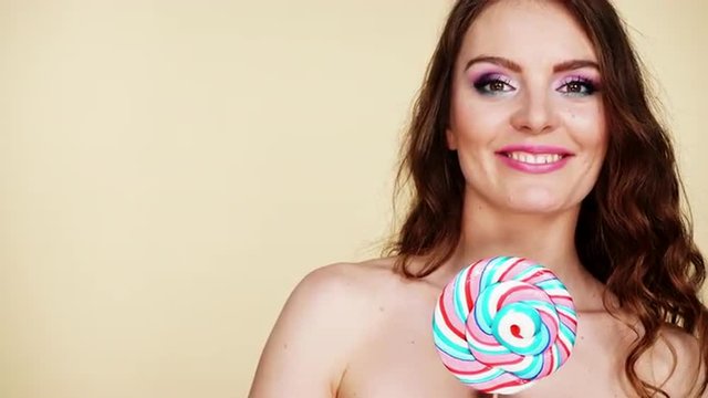 Woman shirtless girl with lollipop candy 4K