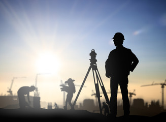 Silhouette Successful male engineer standing survey work on cons - obrazy, fototapety, plakaty