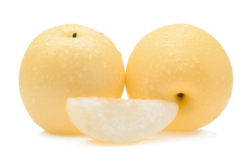 yellow pear with water drops on white background