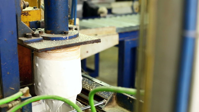 Glulam production. View of roller with glue
