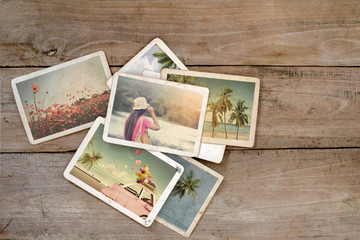 Fototapeta na wymiar Summer photo album on wood table. instant photo of polaroid camera - vintage and retro style