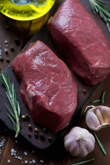 Close-up of raw fresh asado marbled beef steaks, studio shot