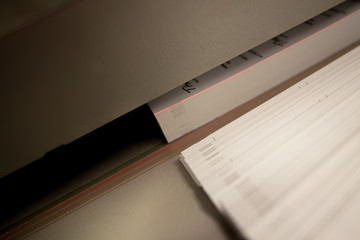 Electric paper guillotine cutting printed production