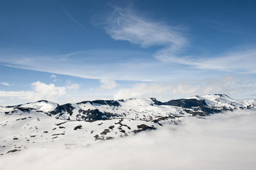 Fototapeta na wymiar Peaks of mountains above the clouds, mountain Dalsnibba view to Geiranger fjord, Norway