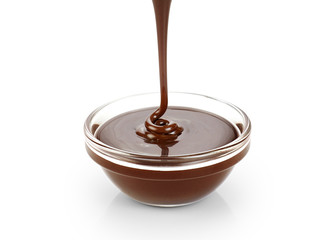 Pouring dark melted chocolate isolated on white background.