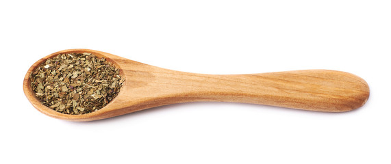 Wooden spoon and dried basil