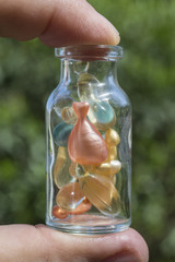 Gel capsules in a glass bottle