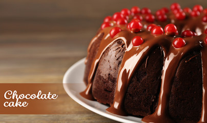 Chocolate cake with snowball tree berries on a table