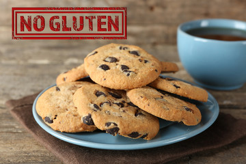 Chocolate chip cookies on plate and no gluten sign on wooden background