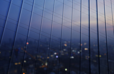 Reflection of blurred aerial view of cityscape on warm light sun