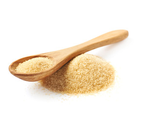Spoon over pile of sugar