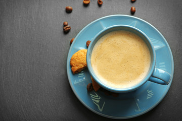 Cup of coffee on gray background
