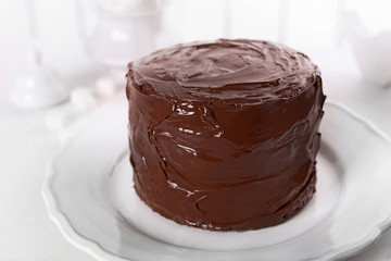 Tasty chocolate cake on light background