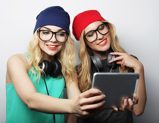 two hipster girls friends taking selfie