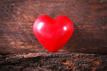 Fototapeta premium Valentine concept. Red heart on wooden background