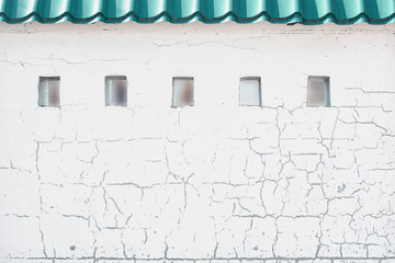 The old whitewashed wall with windows © stockshishkin