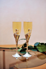 two glasses of champagne on the table for wedding ceremony