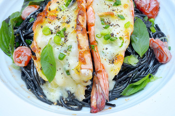 The black ink spaghetti with prawns, cheese.
