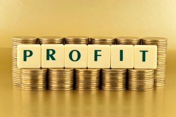 The letters PROFIT with stacks of coins