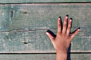 hand, numbers and wood