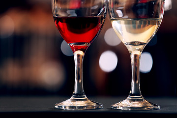 Glasses of red and white wine closeup