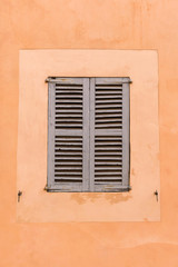 Fototapeta na wymiar Old Window with closed sunblind