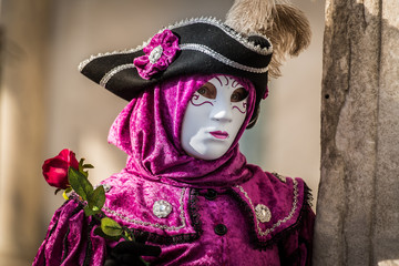 Venice - February 6, 2016: Colourful carnival mask through the streets of  Venice and in St. Mark's Square during celebration of the most famous carnival in the world.