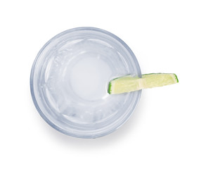 Glass of water with lime slice isolated on white background, top view