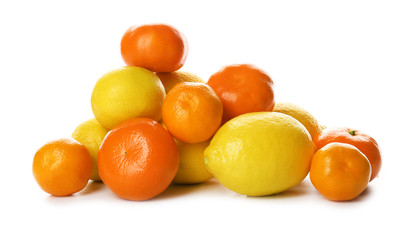 A heap of mixed citrus fruit including   lemons and tangerines  isolated on a white background, close up