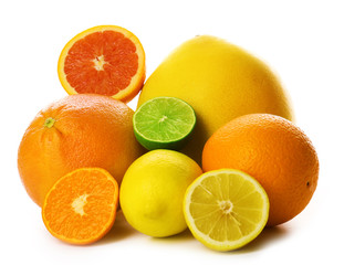 Mixed citrus fruit including lemon, limes, grapefruit, pomelo, orange and tangerine isolated on a white background, close up