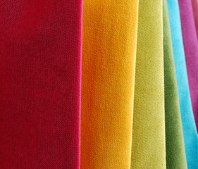 Bright collection of colorful velour textile samples. Fabric texture background