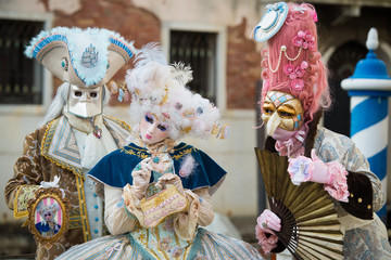 Venice - February 6, 2016: Colourful carnival mask through the streets of  Venice and in St. Mark's...