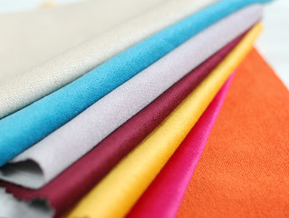 Bright collection of colorful velour textile samples. Fabric texture background