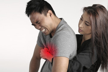 Young woman doing the first aid to a man