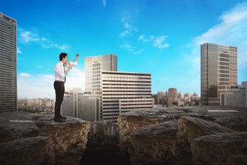 Business person using bullhorn