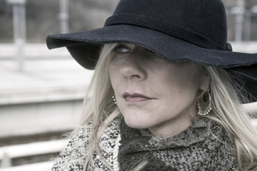 portrait of woman waiting at train station