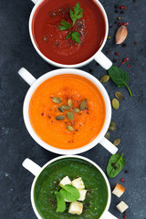 assortment of vegetable cream soup on a dark background